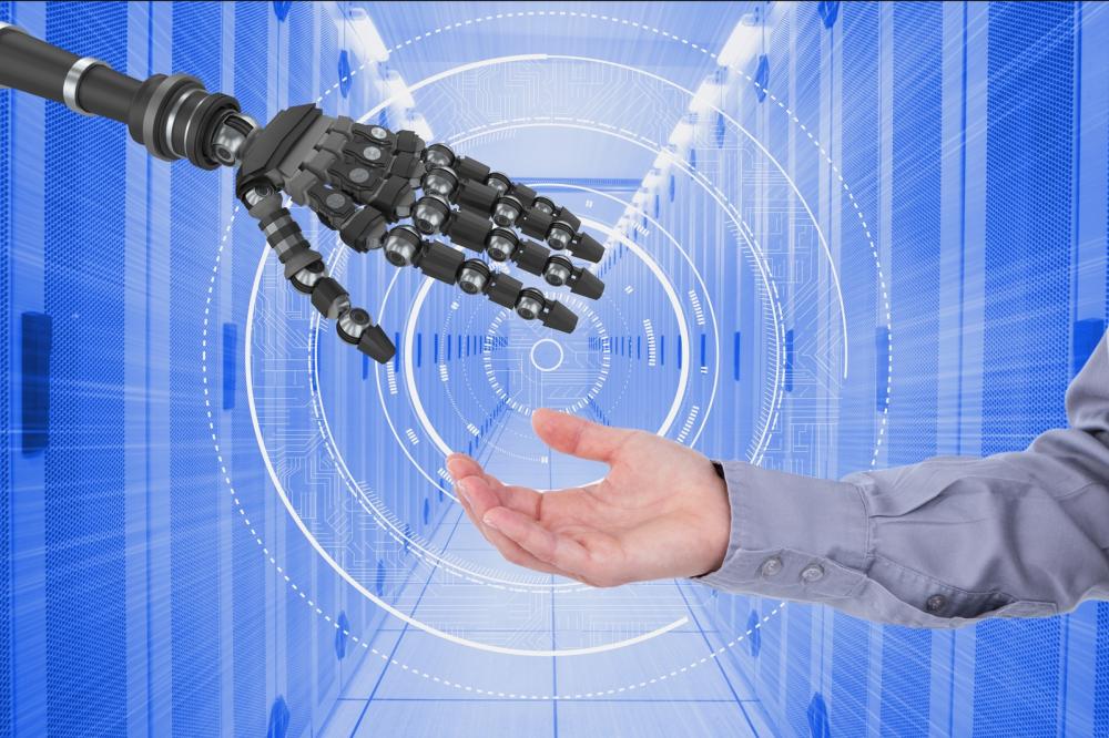 An industrial automation concept showing a human and a robotic hand
