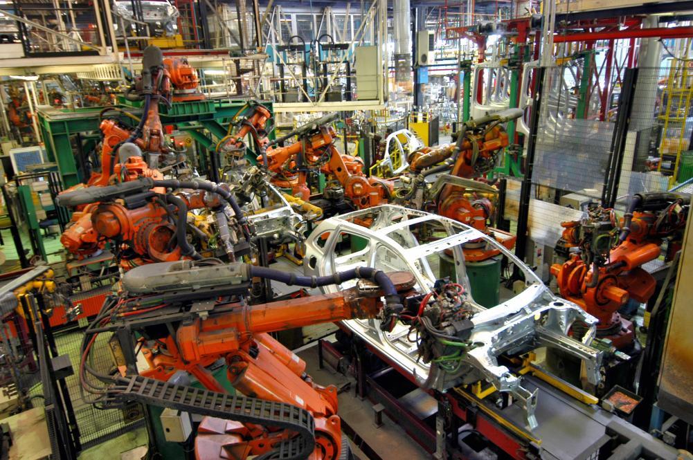 Various robots assembling a car’s structure