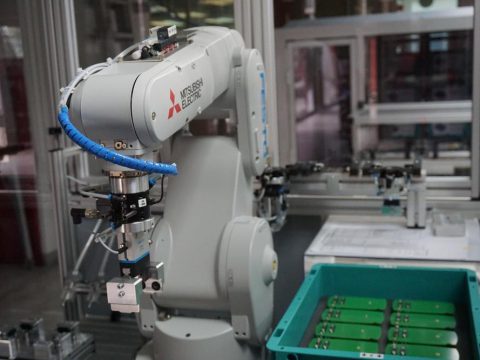 Robot doing work in a factory